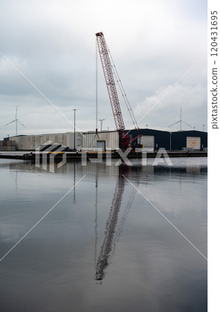 Loading cranes of the VCK Logistics company in the Bering and Suez port of Amsterdam, Netherlands 120431695