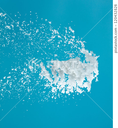 Snow dust element falling over blue sky. Fluffy White snow splash flying or throwing in mid air. Snowfall on blue background isolated Snow dust element falling over blue sky. Fluffy White snow splash flying or throwing in mid air. Snowfall on blue background isolated 120432826