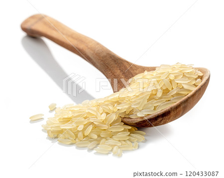 spoon of raw rice 120433087