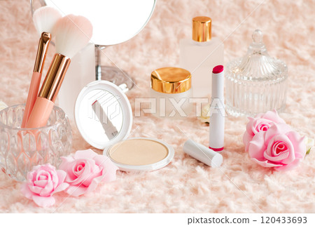 Makeup accessories and cosmetics arranged on fluffy fur fabric Makeup accessories and cosmetics arranged on fluffy fur fabric 120433693