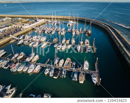 Aerial view of Santa Marta lighthouse and Cascais marina with Cascais cityscape Aerial view of Santa Marta lighthouse and Cascais marina with Cascais cityscape 120433825