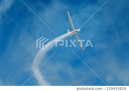Stunt aerobatic plane performing stunts in air 120433829