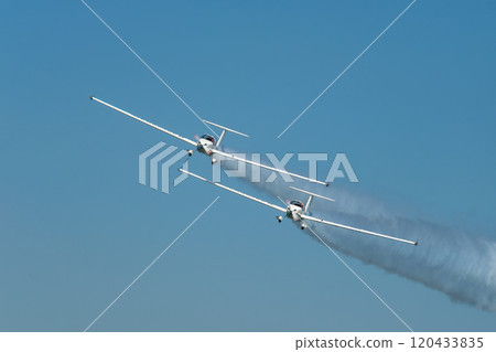 Stunt aerobatic plane performing stunts in air 120433835