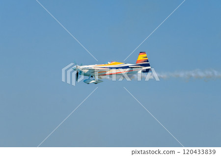 Stunt aerobatic plane performing stunts in air 120433839