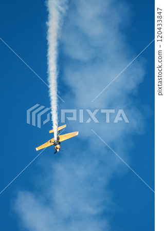 Stunt aerobatic plane performing stunts in air 120433847