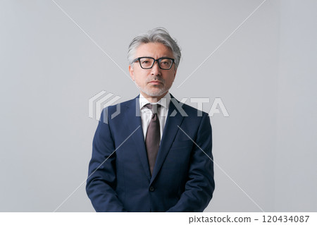 White-haired man in a suit 120434087