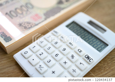 Calculator and money 120434137