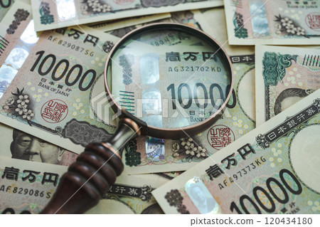 Money and magnifying glass Money and magnifying glass 120434180