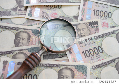Money and magnifying glass Money and magnifying glass 120434187
