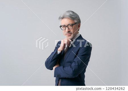 White-haired man in a suit 120434262
