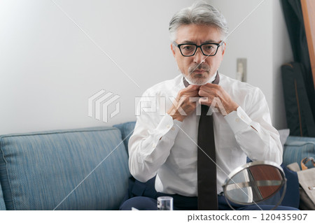 Middle men getting dressed 120435907