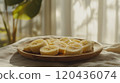 Picture of a plate of banana slices 120436074