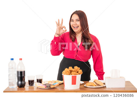 A Delighted Woman Happily Enjoying Fast Food While Making Energetic Gestures 120436086