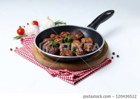 Meatballs in a pan with spices on a white background 120436522
