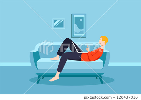 Man working on his laptop on the sofa at home 120437010