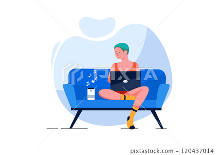 Man with laptop listening to music on wireless speaker at home 120437014