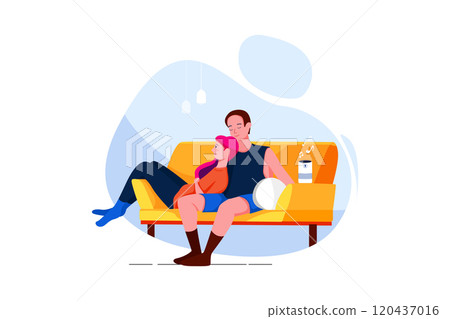Couple sitting on sofa listening to music on wireless speaker 120437016