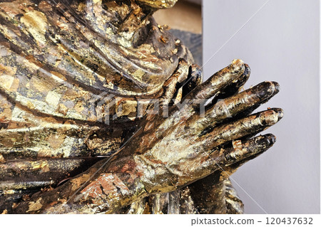 Close up Golden Hands of Monk Statue. 120437632