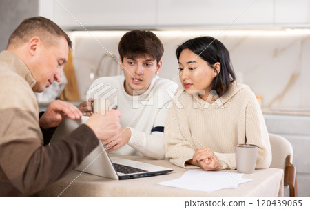 Experienced male agent offers to issue an insurance policy or take out financial loan for spouses at home 120439065