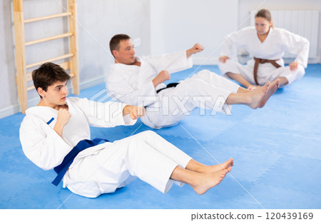 Athlete before martial match performs exercises to strengthen press and improve accuracy of hands Athlete before martial match performs exercises to strengthen press and improve accuracy of hands 120439169