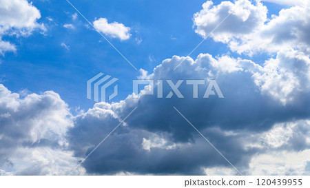 Many white clouds flowing in two layers in the blue autumn sky Many white clouds flowing in two layers in the blue autumn sky 120439955