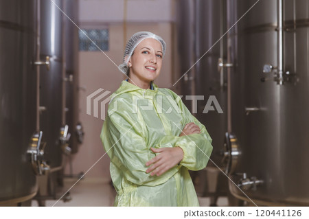 Beautiful winemaker modern large winery factory liquor drink industry quality. Staff inspecting wine in modern wine factory. Winery manufacturing quality control. Alcohol and wine winemaking process Beautiful winemaker modern large winery factory liquor drink industry quality. Staff inspecting wine in modern wine factory. Winery manufacturing quality control. Alcohol and wine winemaking process 120441126