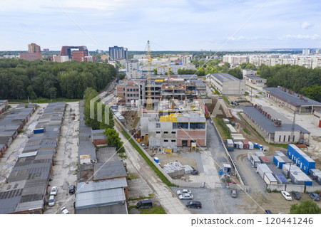 Aerial view of cranes at the construction of an industrial building in Novosibirsk, Russia 120441246
