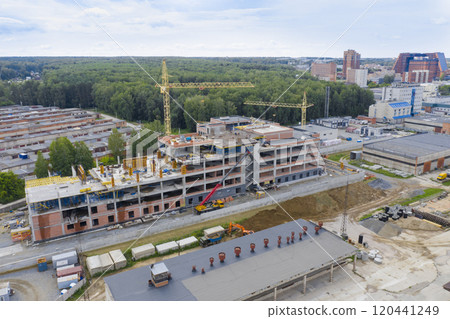 Aerial view of cranes at the construction of an industrial building in Novosibirsk, Russia 120441249