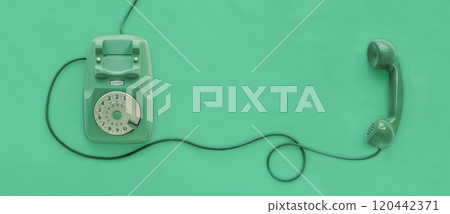 A green vintage dial telephone. A green vintage dial telephone. 120442371