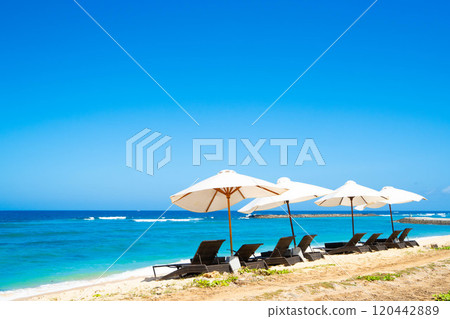 Tropical sea and beach umbrella Tropical sea and beach umbrella 120442889