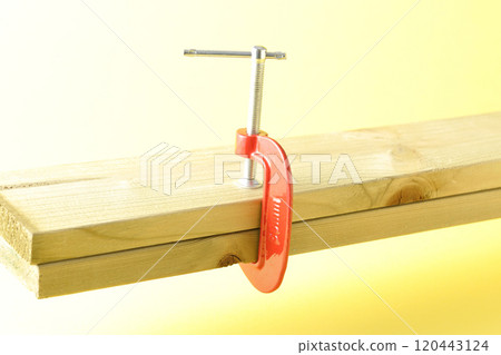 Clamp the lumber to hold it in place 120443124