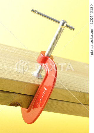 Clamp the lumber to hold it in place 120443129