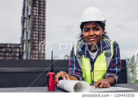 Engineers with draft plan of building on constructing site. Engineer working on building site. Engineer working with drawing System plan document Engineers with draft plan of building on constructing site. Engineer working on building site. Engineer working with drawing System plan document 120443830