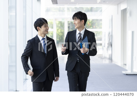 Smiling young man in a business suit 120444070