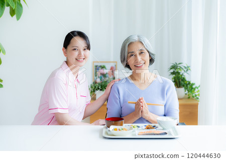 Caregiver preparing meals Caregiver preparing meals 120444630