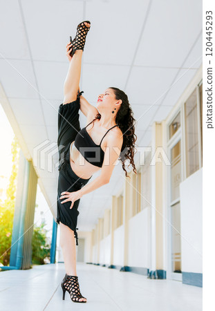 Dance artist woman doing acrobatics and flexibilities in heels. Artistic gymnastics concept, Dance girl doing flexibility in high heels. Woman dancer in heels doing yoga flexibilities 120445293