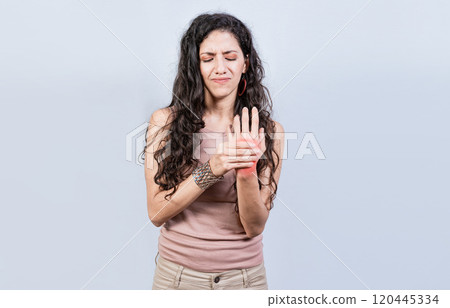 Woman suffering from arthritis in her hands. People with arthritis and hand pain isolated, Girl suffering with joint pain of hands 120445334