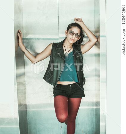 portrait of a girl in an elevator, Cute girl in an elevator, hipster girl outside an elevator, concept of a woman in an elevator portrait of a girl in an elevator, Cute girl in an elevator, hipster girl outside an elevator, concept of a woman in an elevator 120445665