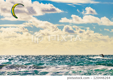 Kite surfer riding waves. Kiteboarding sport. 120446264