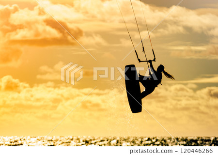 Kite surfer riding waves. Kiteboarding sport. 120446266