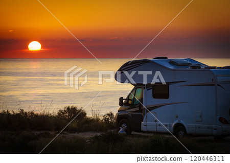 Caravan on sea at sunrise. 120446311