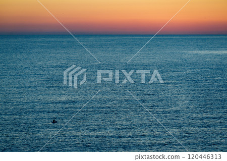 Sunrise over sea water 120446313