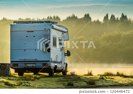 Rv caravan on lake shore. Autumn time, foggy morning Rv caravan on lake shore. Autumn time, foggy morning 120446472