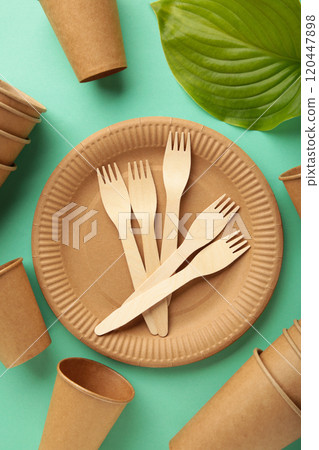 Eco friendly disposable tableware on a mint background 120447898