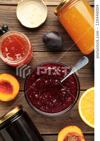 Assortment of jams, seasonal fresh berries and fruits on grey background. 120448004