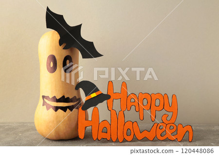 Inscription Happy Halloween with pumpkin on grey background Inscription Happy Halloween with pumpkin on grey background 120448086