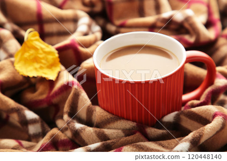 Glass cup of coffee with plaid. Autumn concept Glass cup of coffee with plaid. Autumn concept 120448140