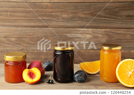 Homemade fruit jam in the jar on grey background. Top view 120448254
