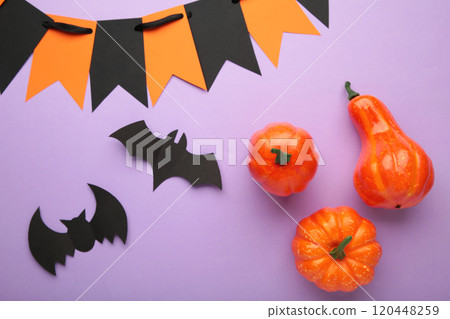 Halloween composition with bats and pumpkins on purple background. View from above. 120448259
