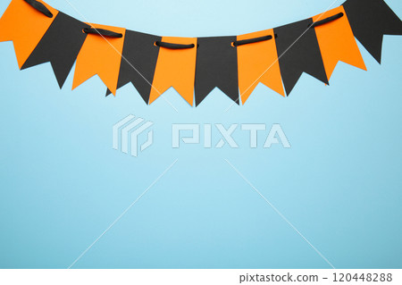 Blank and orange party flags for Halloween decoration on blue background Blank and orange party flags for Halloween decoration on blue background 120448288